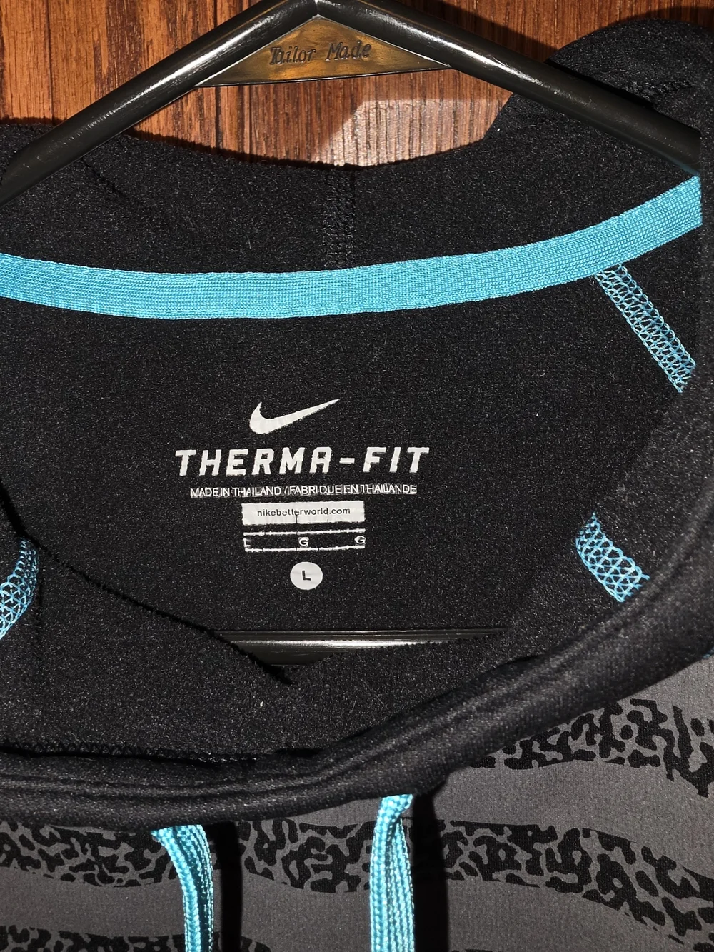 Nike Black Hoodie with Teal Accents and Striped Front